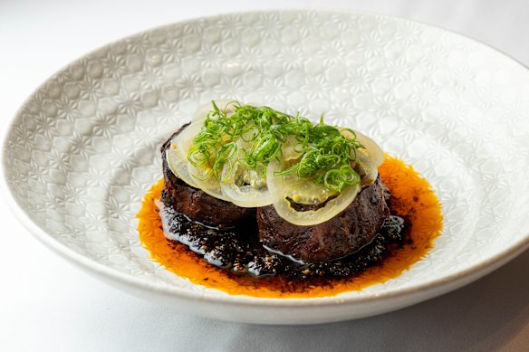 Braised wagyu brisket with pickled green tomatoes and salsa macha.