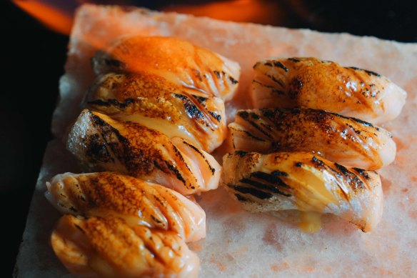 Torched nigiri, one of up to nine pieces of sushi offered.