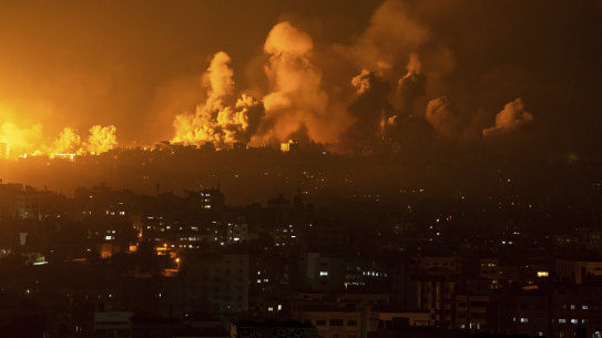 Fire and smoke rise following an Israeli airstrike, in Gaza City.