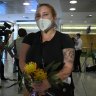 ‘The whole plane was clapping’: First quarantine-free flights arrive to Tim Tams and native flowers