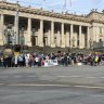 Politicians join protesters on steps of Victoria’s State Parliament