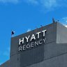 Dangerous skylarking on the rood of the Hyatt Regency in Brisbane.