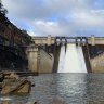 Warragamba Dam spills over as flash flooding warning issued for NSW South Coast