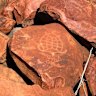 More than 1 million petroglyphs are scattered around Murujuga National Park, which overlooks Woodside’s Karratha operations.