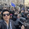 Farrah Tomazin stands in front of the crowd outside the Manhattan courtroom where Donald Trump’s hush-money trial was held.