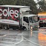 A Coles truck is stuck in a sink hole that has formed outside St Mary’s Cathedral in the Sydney CBD.