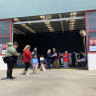 Melton voters at an early voting centre housed in a disused Bunnings Warehouse on Tuesday.