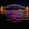 Maroon city: Sydney Harbour Bridge lights up for Queensland