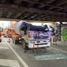 
Stills from footage of a cement mixer that collided with Montague Street bridge at South Melbourne on Wednesday.