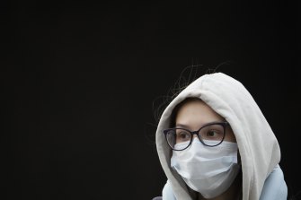 A young woman wearing a face mask to help curb the spread of the coronavirus leaves a subway in Moscow.