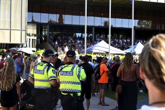 Police observe an anti-vaccine mandate rally outside Fremantle’s council offices.