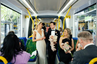 Melbourne couple Madeline and Richard Greco on board the tram on their way to their wedding.