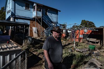 Martin Knibbs surveys his flooded home in Windsor, on the Hawkesbury, on Saturday.