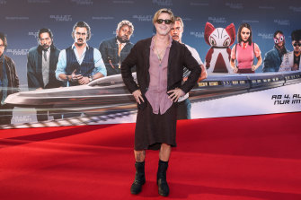 Brad Pitt attends the “Bullet Train” Red Carpet Screening at Hotel Adlon on July 19, 2022 in Berlin wearing a skirt and matching jacket from NY designer Haans Nicholas Mott.