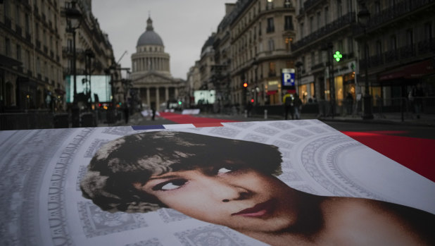 Pictures of Josephine Baker and a red carpet lead to the Pantheon monument, rear, in Paris on Tuesday.