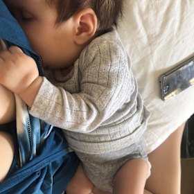 Kale Rayment breastfeeds her baby.