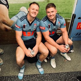 Ethan Strange and Hudson Young celebrate in the NSW sheds on Wednesday night.
