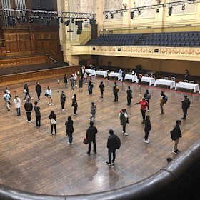 International students lined up at Melbourne Town Hall to receive a food voucher last year.