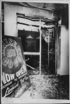 The heat-buckled and charred front entrance of the death club. Glass door exploded in the intense heat. March 8, 1973.