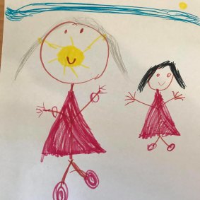 Maya, 6, drew herself going on a walk with her mum while wearing a mask. 