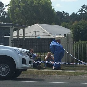 Police comfort the foster mother of the woman found dead at her Crestmead home