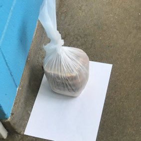 Two pies left outside the door of North Melbourne towers resident Ahmed Dini.