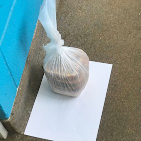 Two pies left outside the door of North Melbourne towers resident Ahmed Dini.