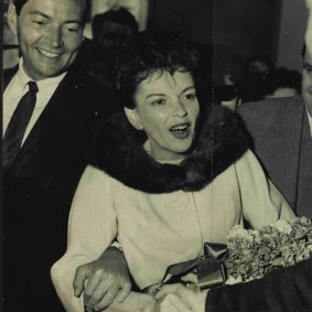 Judy Garland arrives at Sydney Airport with Mark Herron in 1964.