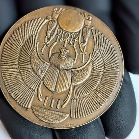 Copper medal given to Dr Thomas Young, the British pyhysicist who helped crack Egyptian hieroglyphs using the Rosetta Stone in the early 1800s.