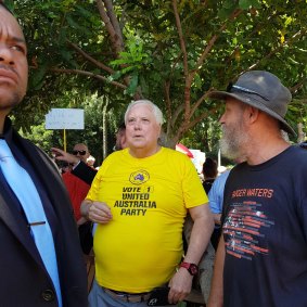 Clive Palmer (centre) attended the Brisbane rally on Saturday.