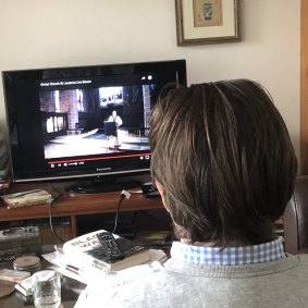 A parishioner watches the Christchurch St Laurence Easter services being live streamed. 