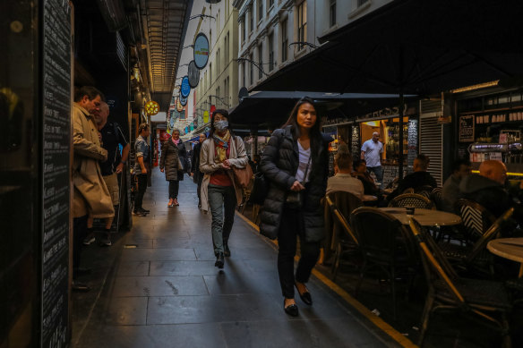 Pedestrians walk through Degraves Street on Tuesday following the government announcement.