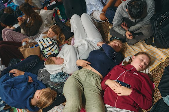 After hours of queuing, revellers were waiting – and snoozing – in their positions at Mrs Macquaries Chair.