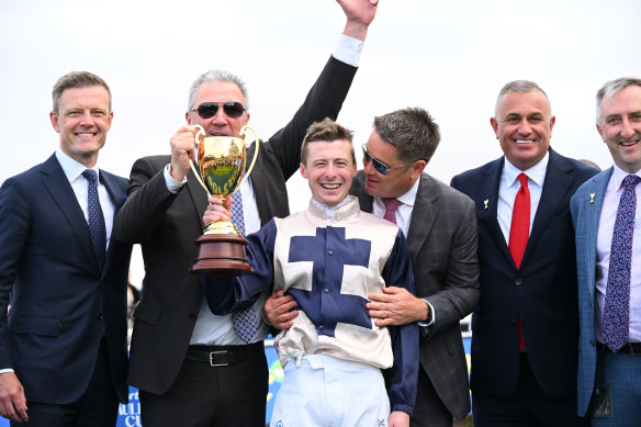 Harry Coffey poses with connections after riding Duke De Sessa.