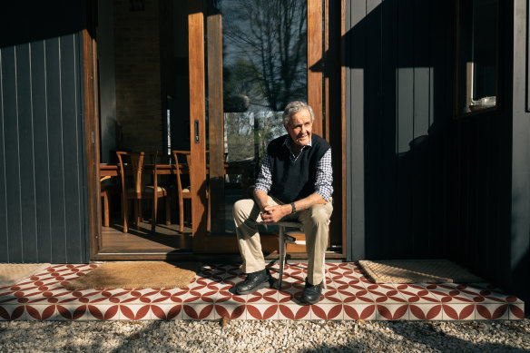 Retired stockbroker Nicholas Wright sits outside his Dorrigo home. 