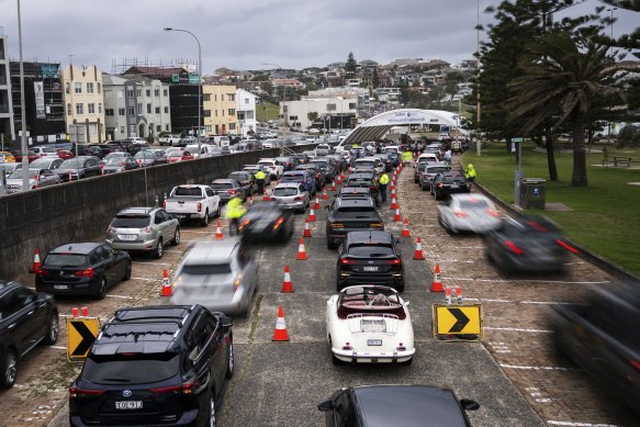 Cars queue for testing at SydPath’s Bondi Beach testing clinic on Monday.