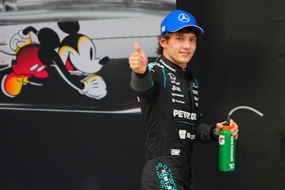Kimi Antonelli is all smiles as he claims his maiden GP win.
