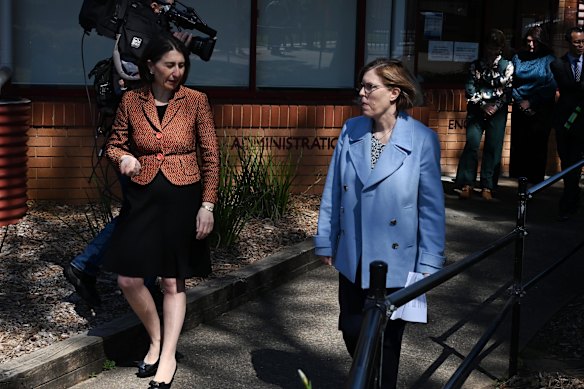 NSW Premier Gladys Berejiklian with Chief Health Officer Kerry Chant, who said NSW Health was investigating whether the virus might have been spread through contact with surfaces.