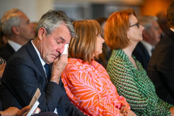 Attorney-General Mark Dreyfus (left) wipes away tears.