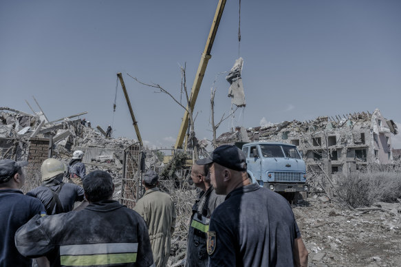 Rescue workers clear debris following a Russian missile strike in the Serhiivka village of the Bilhorod-Dnistrovskyi district, south-west of Odesa, Ukraine, on July 1, 2022.