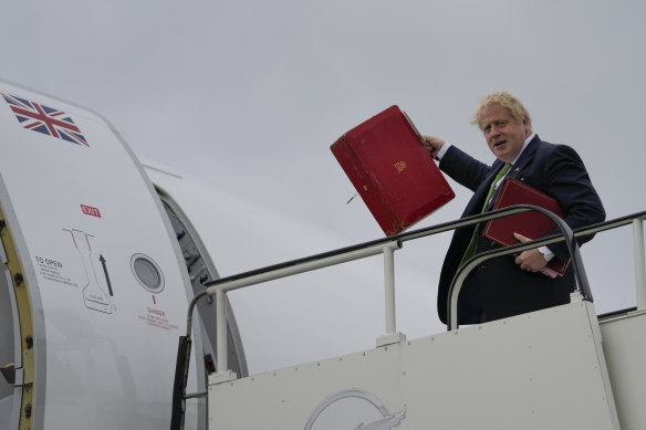British Prime Minister Boris Johnson boards a plane bound to Stockholm, at the London Stansted Airport.