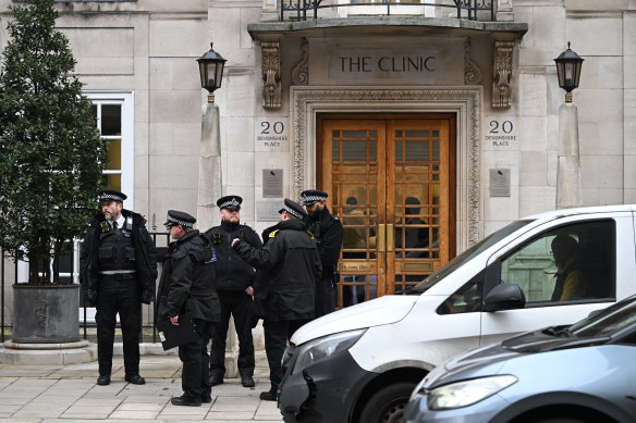 Police officers standing outside The London Clinic the day after Princess Catherine was admitted.