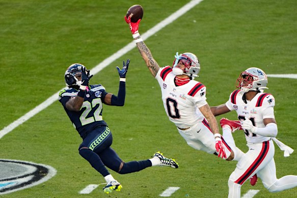 New England Patriots cornerback Christian Gonzalez breaks up a pass intended for Seattle Seahawks wide receiver Rashid Shaheed.