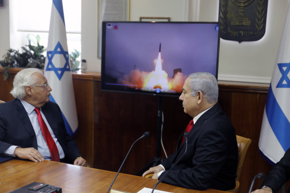 Israeli Prime Minister Benjamin Netanyahu, right, and then-US Ambassador to Israel David Friedman watch a video of the launch of the Arrow 3 hypersonic anti-ballistic missile in 2019.