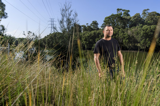Indigenous architect Dillon Kombumerri at the Cooks River near his home. "I find that while I'm here, I have a responsibility to care for country."  