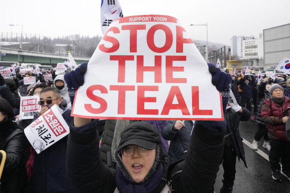 “Stop the steal!” A supporter of impeached South Korean President Yoon Suk Yeol shouts slogans during a rally to oppose his impeachment near the presidential residence in Seoul.