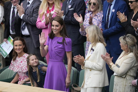 Catherine, wife of heir to the throne Prince William, was greeted by a standing ovation from the Centre Court crowd as she took her seat in the Royal Box.