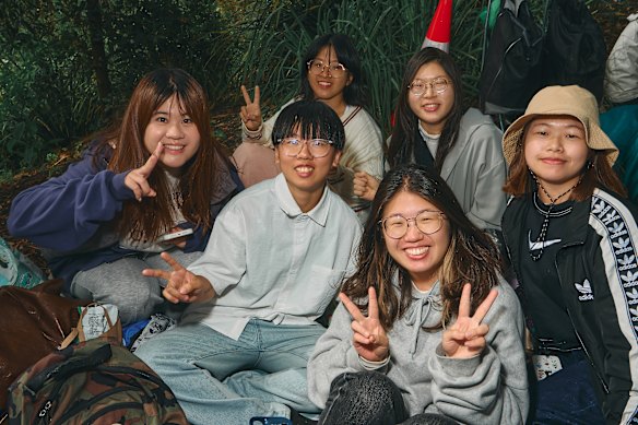 Soren Chen and his friends, from Taiwan, visiting Sydney for the first time, were the first in the queue to watch the fireworks from Mrs Macquaries Chair.