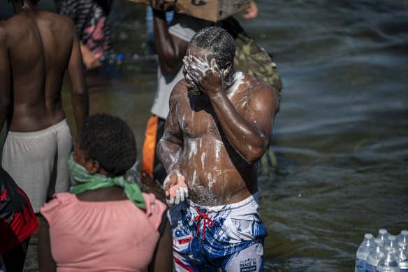 A migrant man washes up in the Rio Grande near Ciudad Acuna, Mexico, on Thursday.