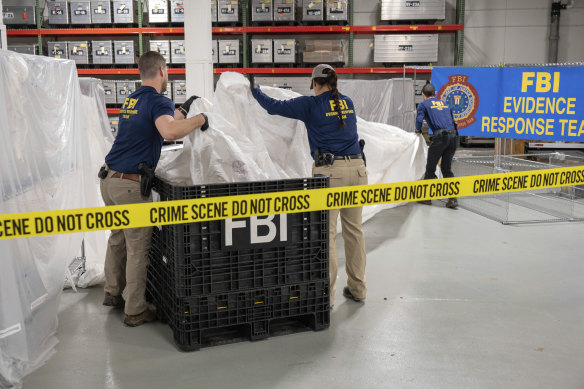 FBI special agents process material recovered from the balloon off the coast of South Carolina, at the FBI laboratory in Quantico, Virginia.